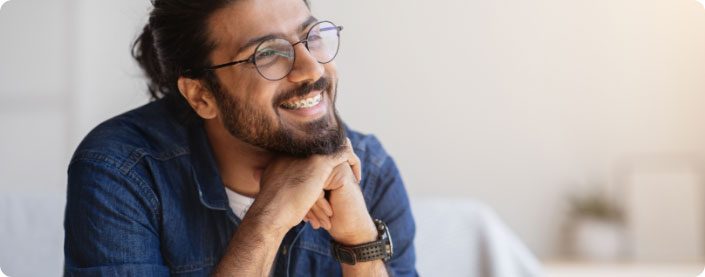 Man smiling with braces.