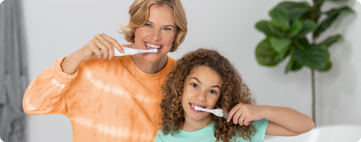 Kids brushing their teeth with Spinbrush.