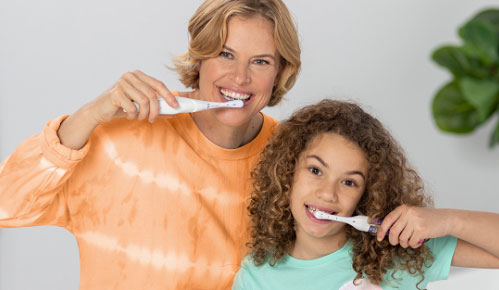 Kids brushing their teeth with Spinbrush.