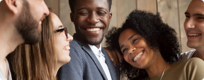 People hanging out and smiling.